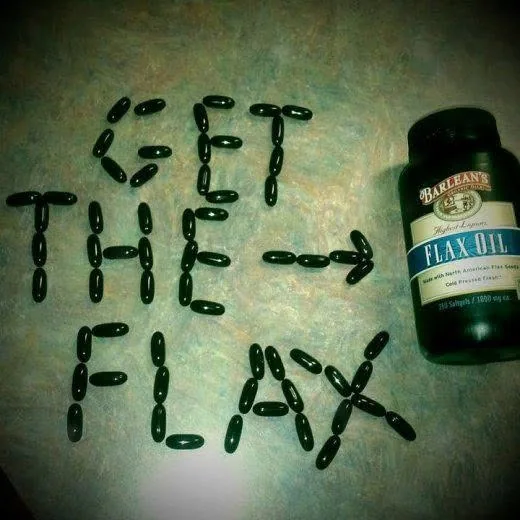 Barlean's flax oil softgels arranged to spell Get The Flax next to a product bottle