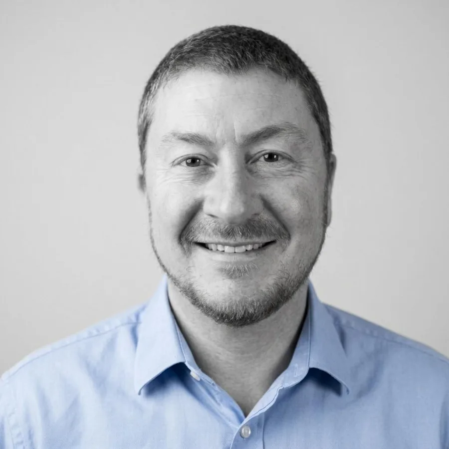 Terence Klein, black and white portrait in a light blue collared shirt