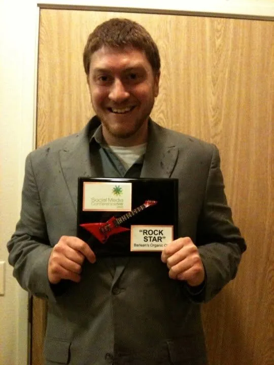 Terence holding the Social Media Conference NW Rock Star award plaque, 2010